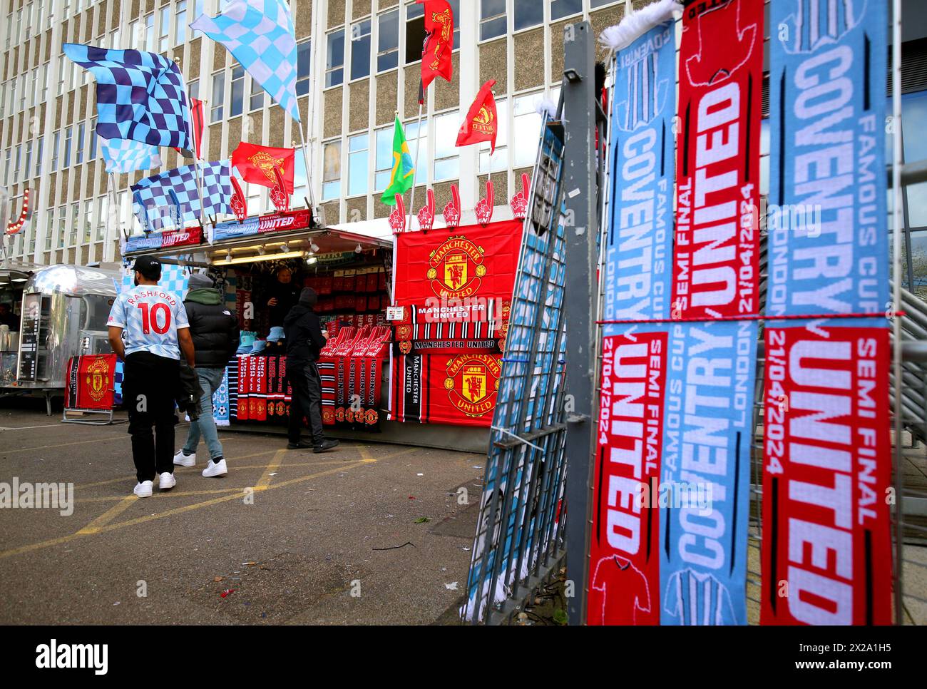 A street vendor sells merchandise ahead of the Emirates FA Cup semi-final match at Wembley Stadium, London. Picture date: Sunday April 21, 2024. Stock Photo