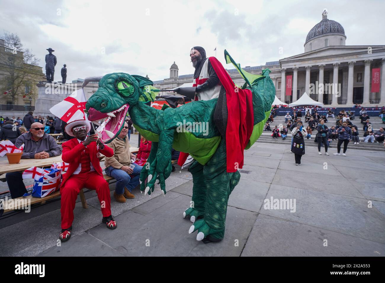 London 21 April 2024 .A man dressed as Saint George riding an inflatable dragon entertains the crowds  in  Trafalgar Square during the Saint George's celebrations. Credit: amer ghazzal/Alamy Live News Stock Photo