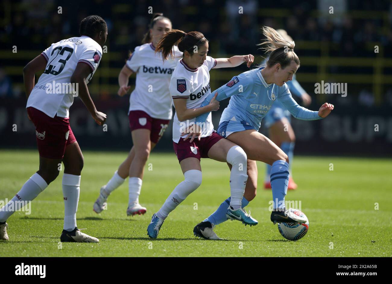 Manchester City's Lauren Hemp against West Ham United's Risa Shimizu during the Barclays Women's Super League match at the Joie Stadium, Manchester. Picture date: Sunday April 21, 2024. Stock Photo