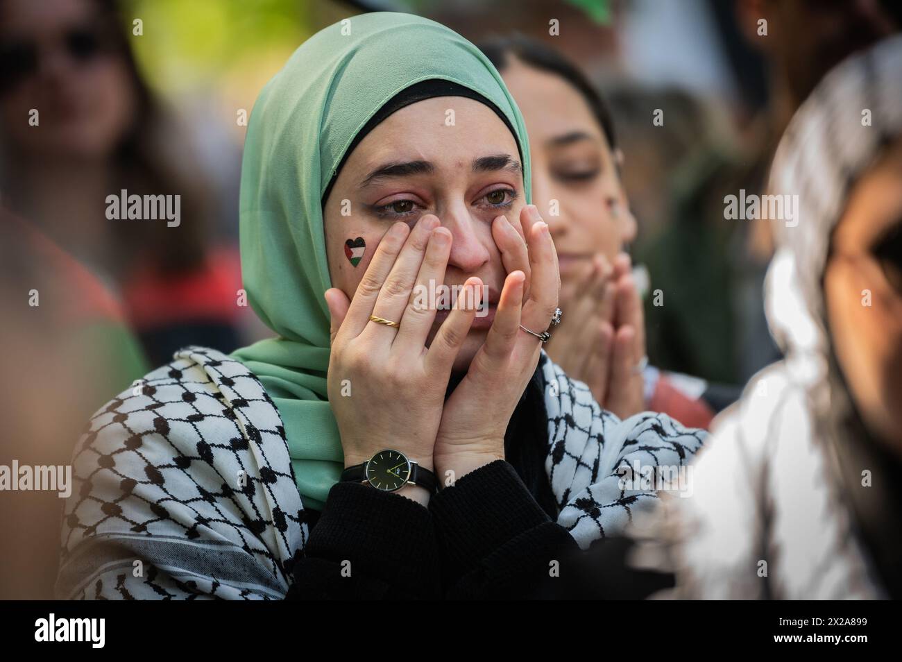 Madrid, Spain. 21st Apr, 2024. A woman is seen crying during a demonstration in support of the Palestinian people. Thousands of people rally in Madrid under the slogan 'stop genocide in Palestine' demanding the end of arms trade with Israel and a definitive ceasefire in the Gaza Strip. Credit: Marcos del Mazo/Alamy Live News Stock Photo