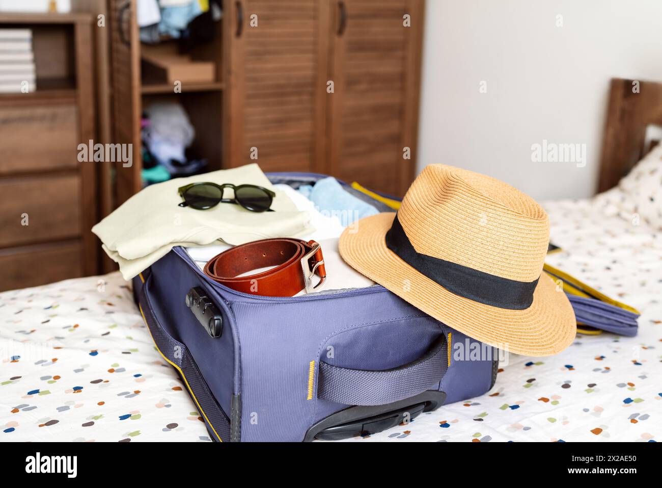 Packing a travel bag. Preparing baggage for the trip. Stock Photo