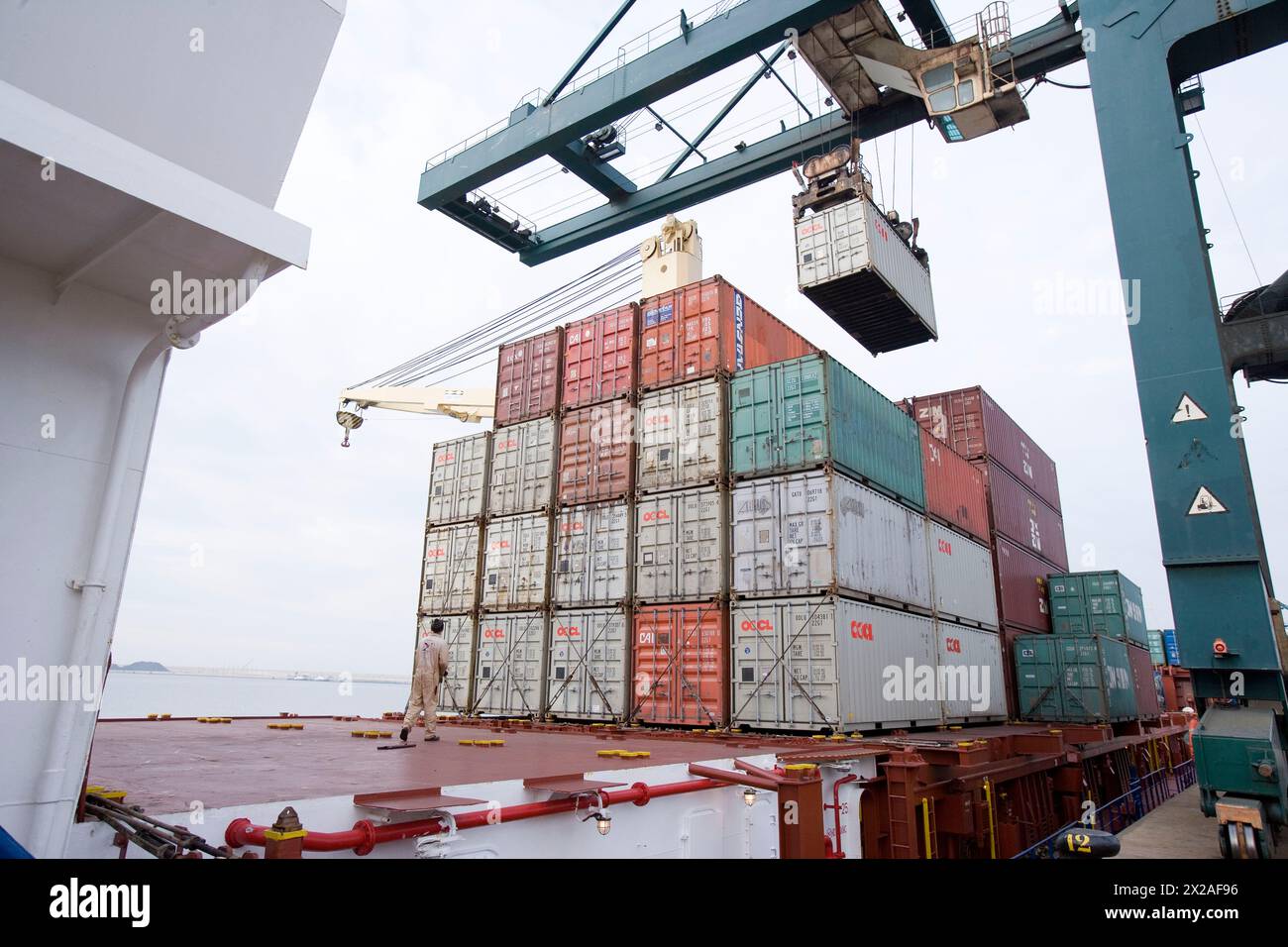 Loading cargo containers in ship, Port of Bilbao, Santurtzi. Biscay, Euskadi, Spain Stock Photo