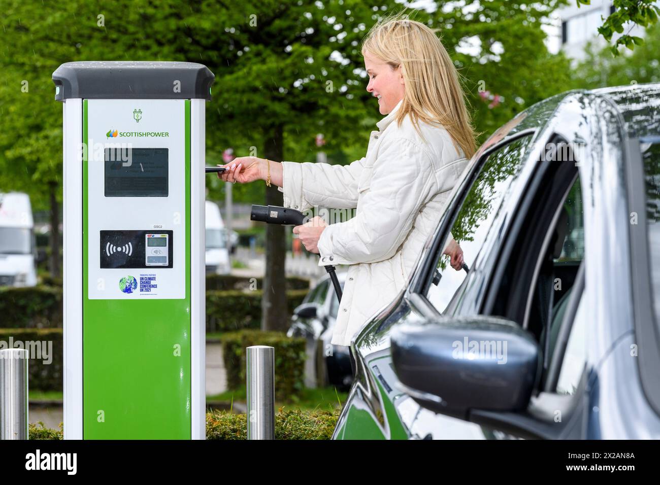 Electric vehicle public charging station hires stock photography and