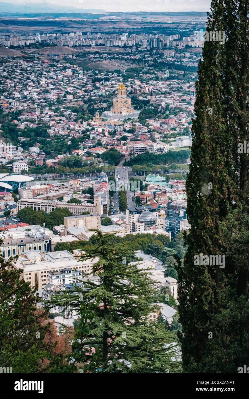 View on the capital city of Tbilisi and the Sameba cathedral from Mtatsminda park (Georgia) Stock Photo