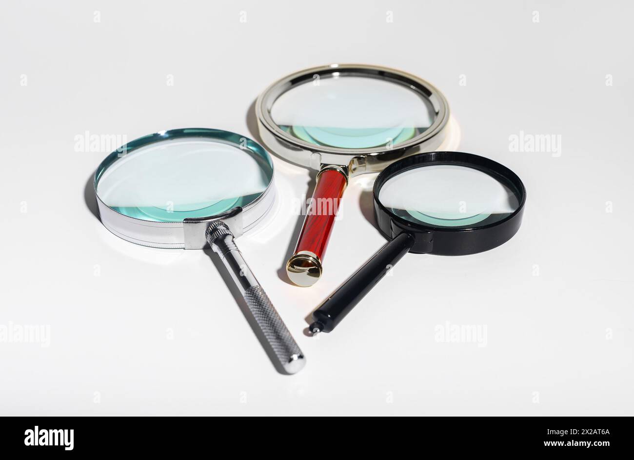 Glass zoom tool for research and analysis. Transparent lens to find details. Business concept of scrutiny and exploration. Scientific discovery and fi Stock Photo