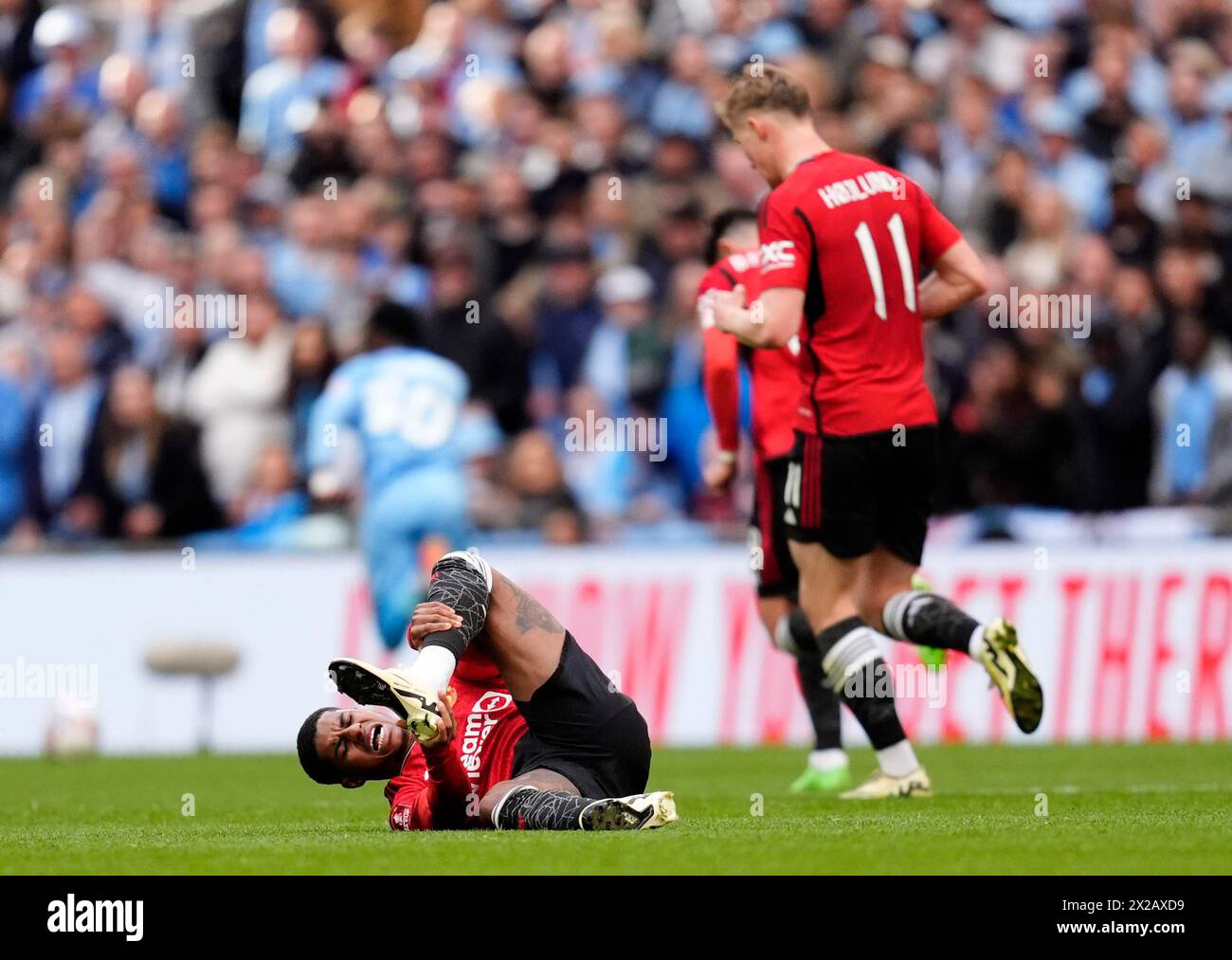 Manchester United's Marcus Rashford goes down injured during the Emirates FA Cup semi-final match at Wembley Stadium, London. Picture date: Sunday April 21, 2024. Stock Photo