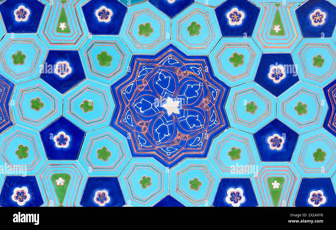 traditional Uzbek pattern on the ceramic tile on the wall of the mosque, background Stock Photo