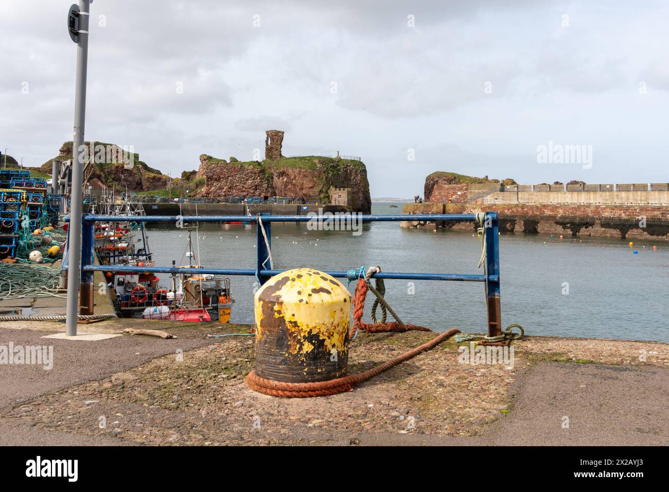 Harbour view in the Scottish fishing town of Dunbar, Scotland, UK,including Dunbar Castle. Stock Photo