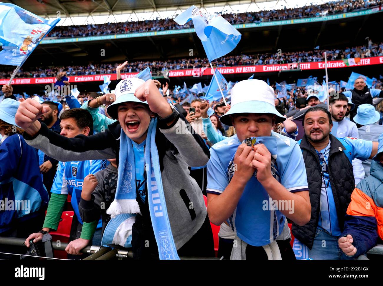 Coventry City fans celebrate after Haji Wright (not pictured) scores their side's third goal of the game from the penalty spot during the Emirates FA Cup semi-final match at Wembley Stadium, London. Picture date: Sunday April 21, 2024. Stock Photo