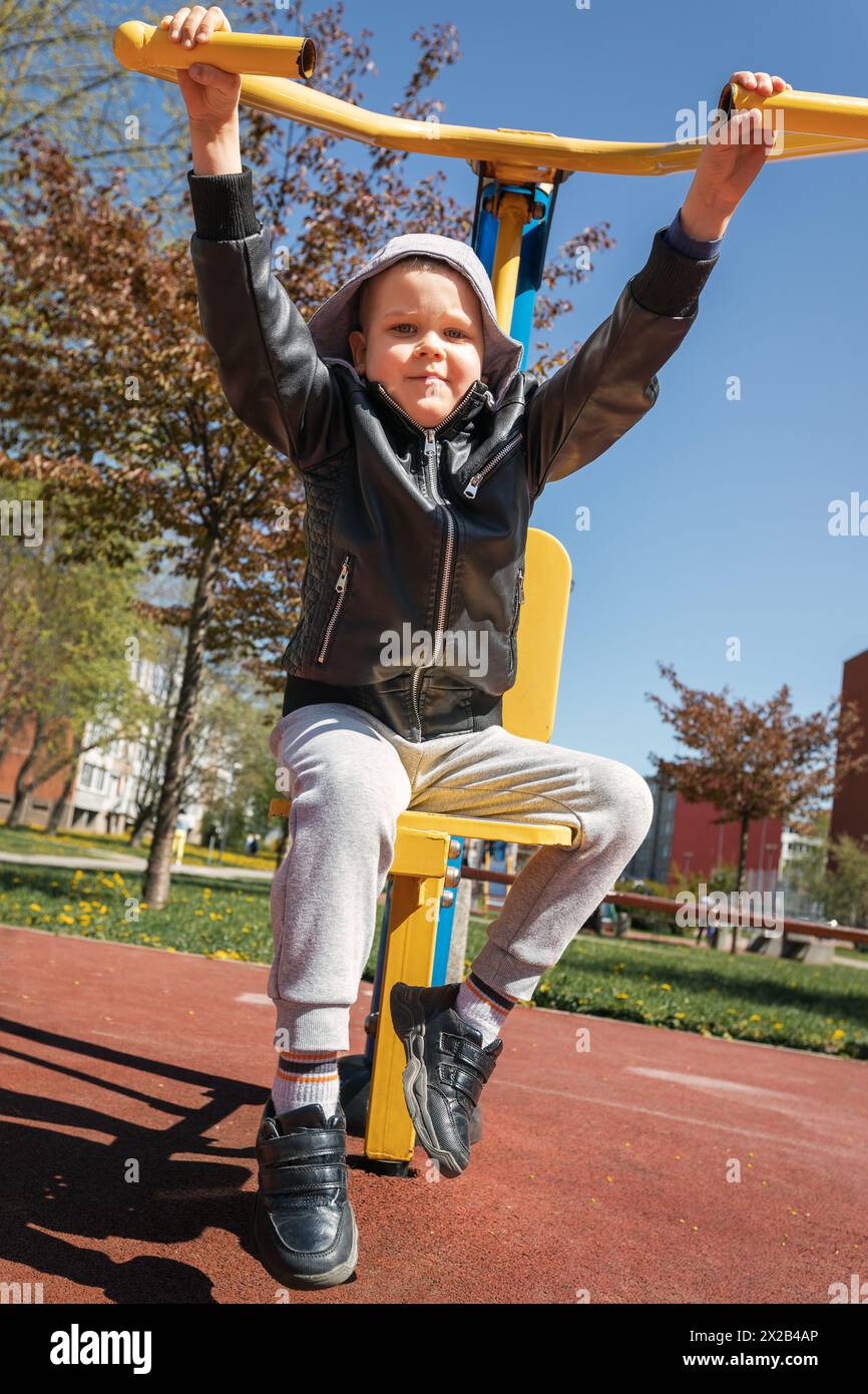 Little boy on outdoor sports field, low angle photo. Stock Photo