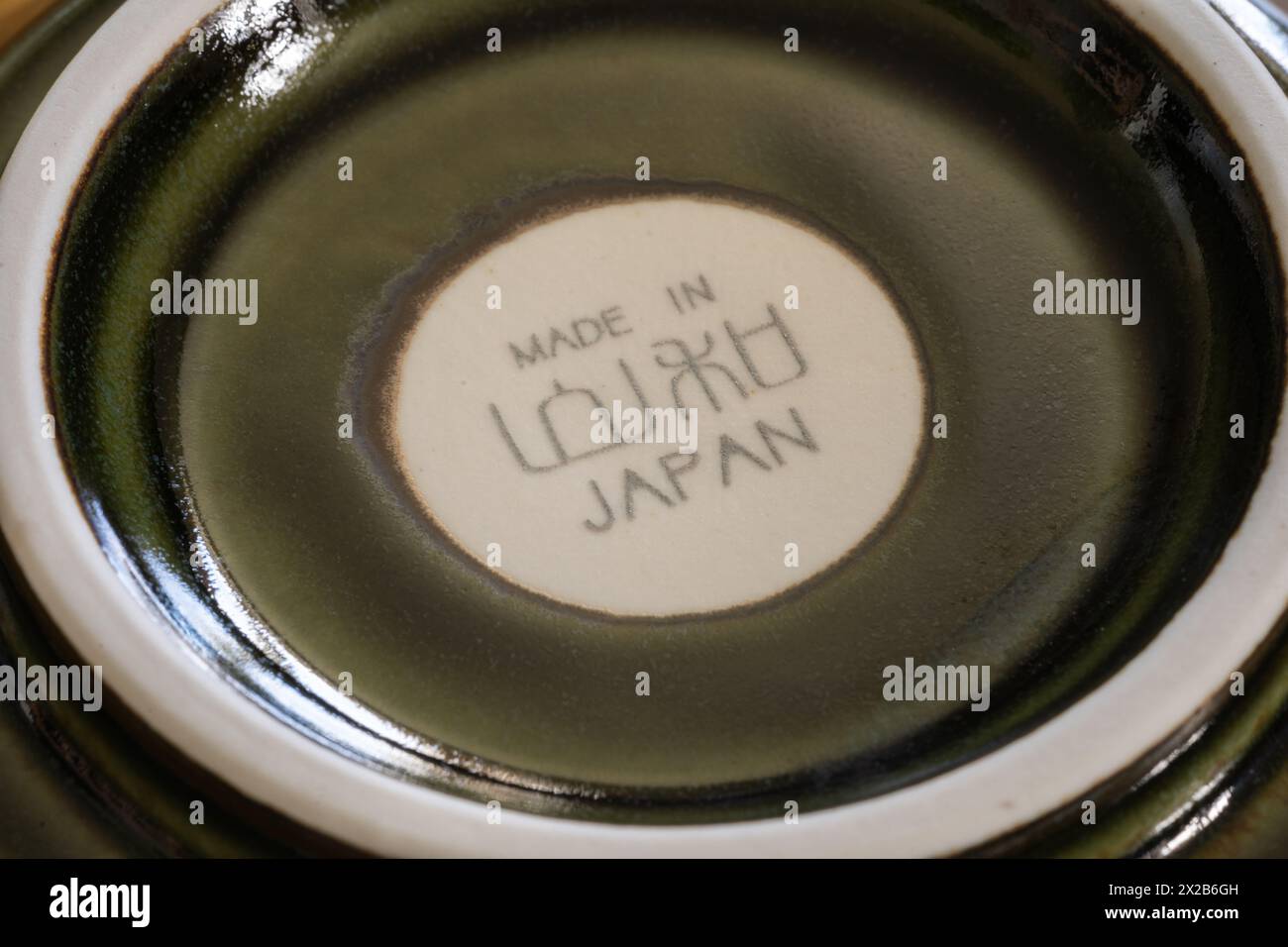 An Asian style bowl with a Made in Japan and Japanese characters mark / label on the base, UK. Concept: Japanese exports, Japan manufacturing Stock Photo