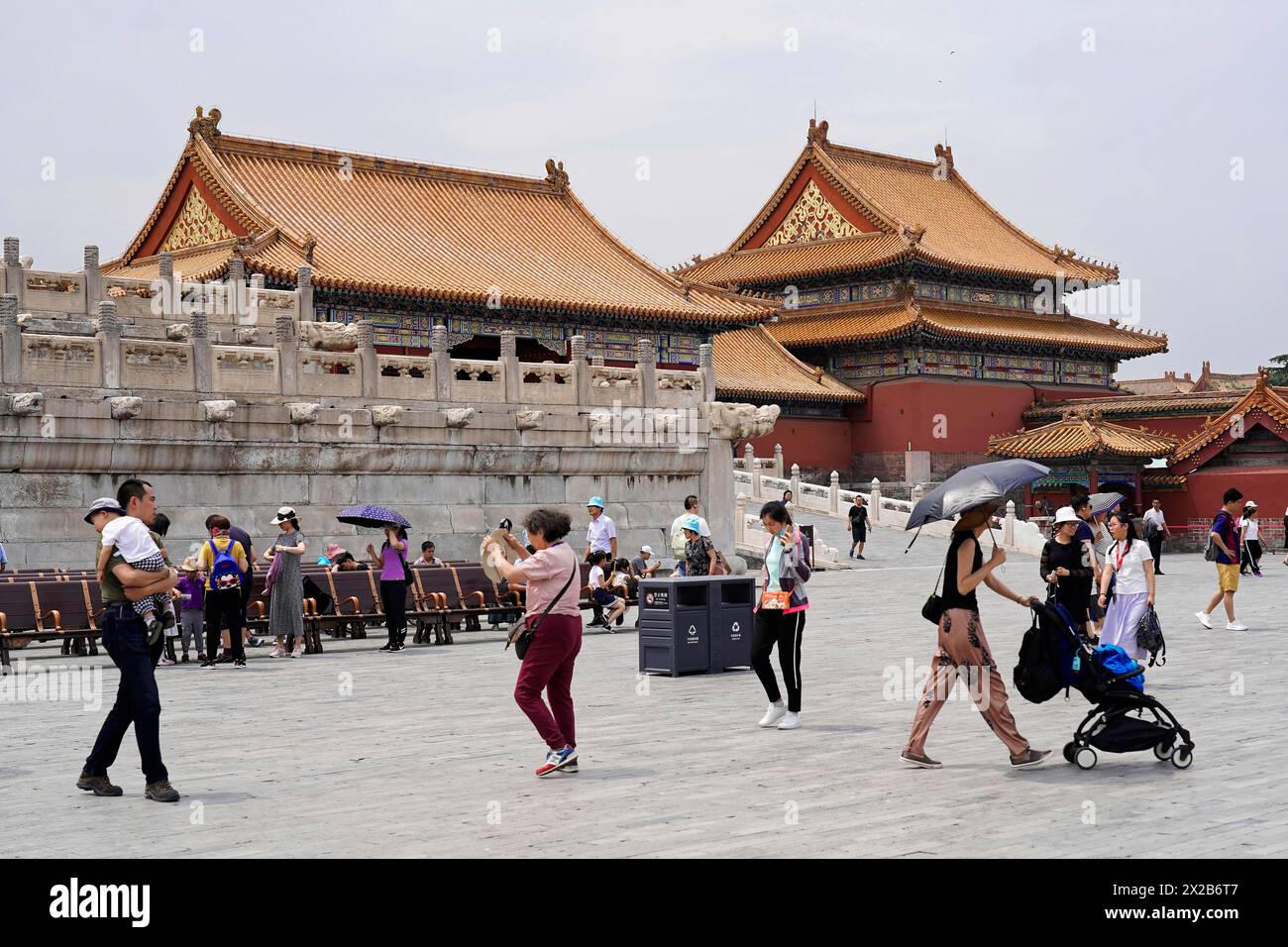 China, Beijing, Forbidden City, UNESCO World Heritage Site, Visitors walk across a wide square in front of imperial Chinese architecture, Forbidden Stock Photo