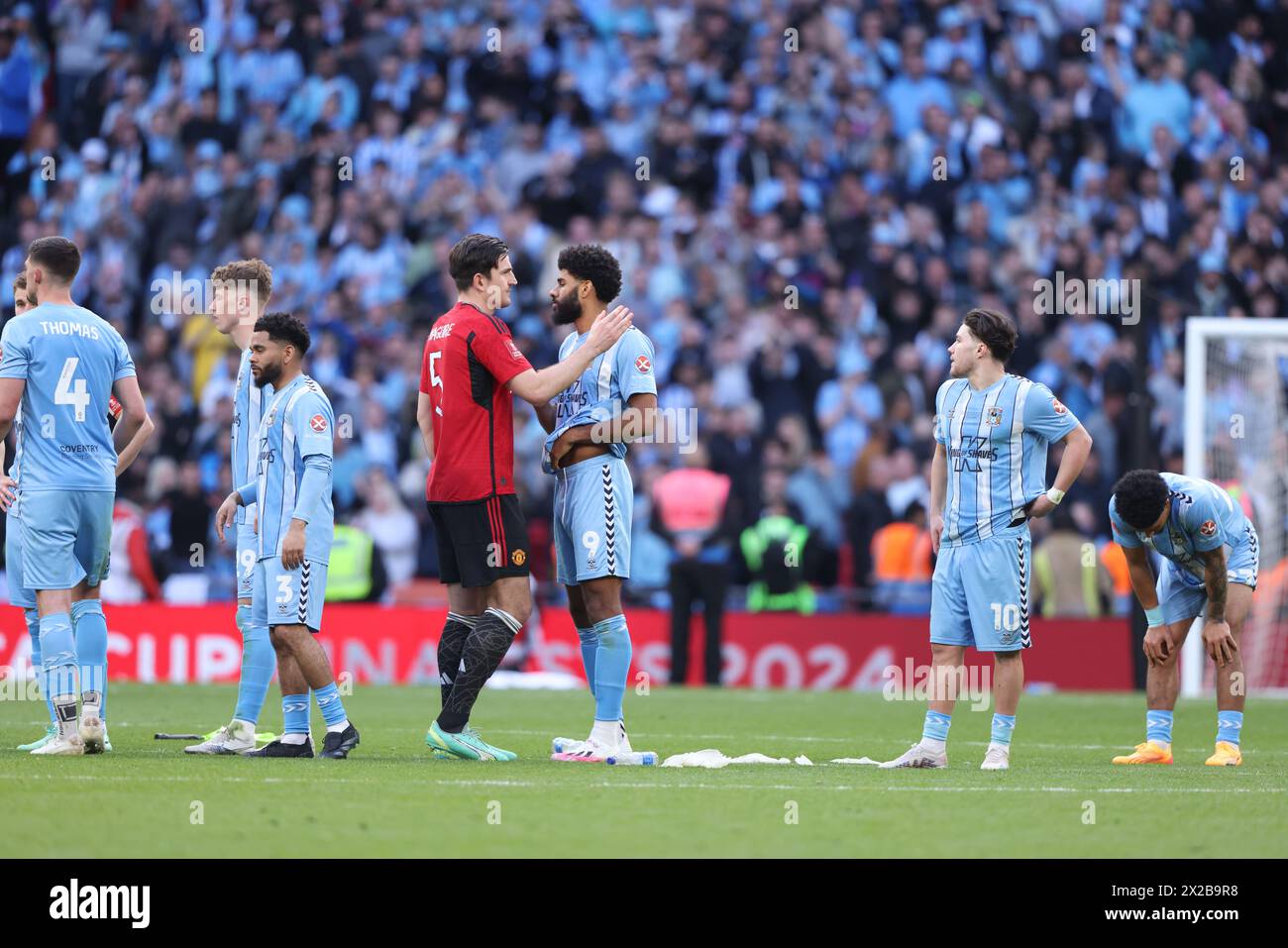London, UK. 21st Apr, 2024. Harry Maguire (MU) goes to Ellis Simms (CC) after the penalties at the Emirates FA Cup Semi-Final match, Coventry City v Manchester United, at Wembley Stadium, London, UK on 21st April, 2024 Credit: Paul Marriott/Alamy Live News Stock Photo