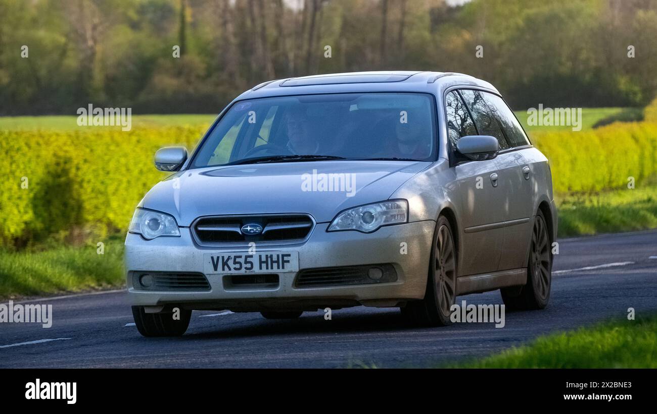 Bicester,UK- Apr 21st2024: 2005 silver Subaru Legacy classic car driving on a British road Stock Photo
