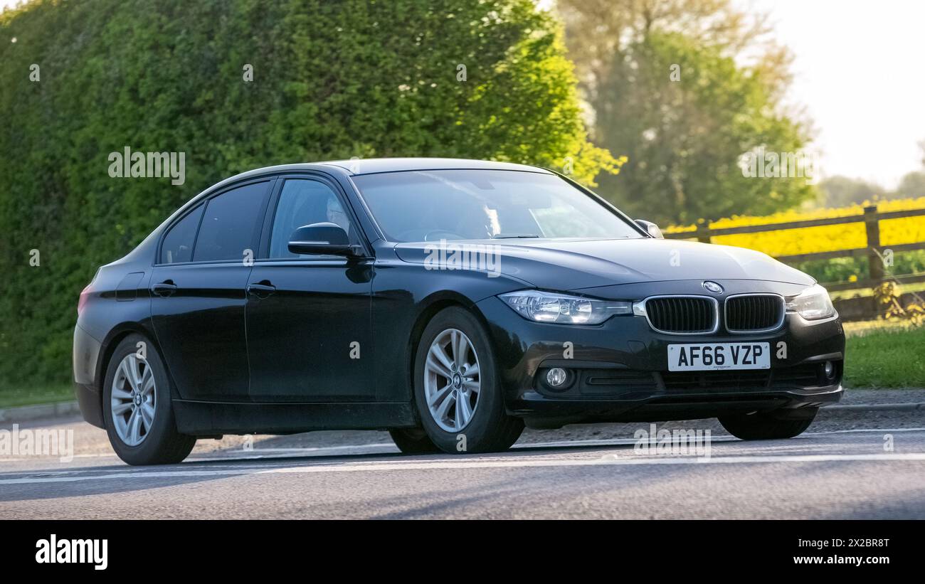 Bicester,UK- Apr 21st2024: 2016 BMW 3 series 320D classic car driving on a British road Stock Photo