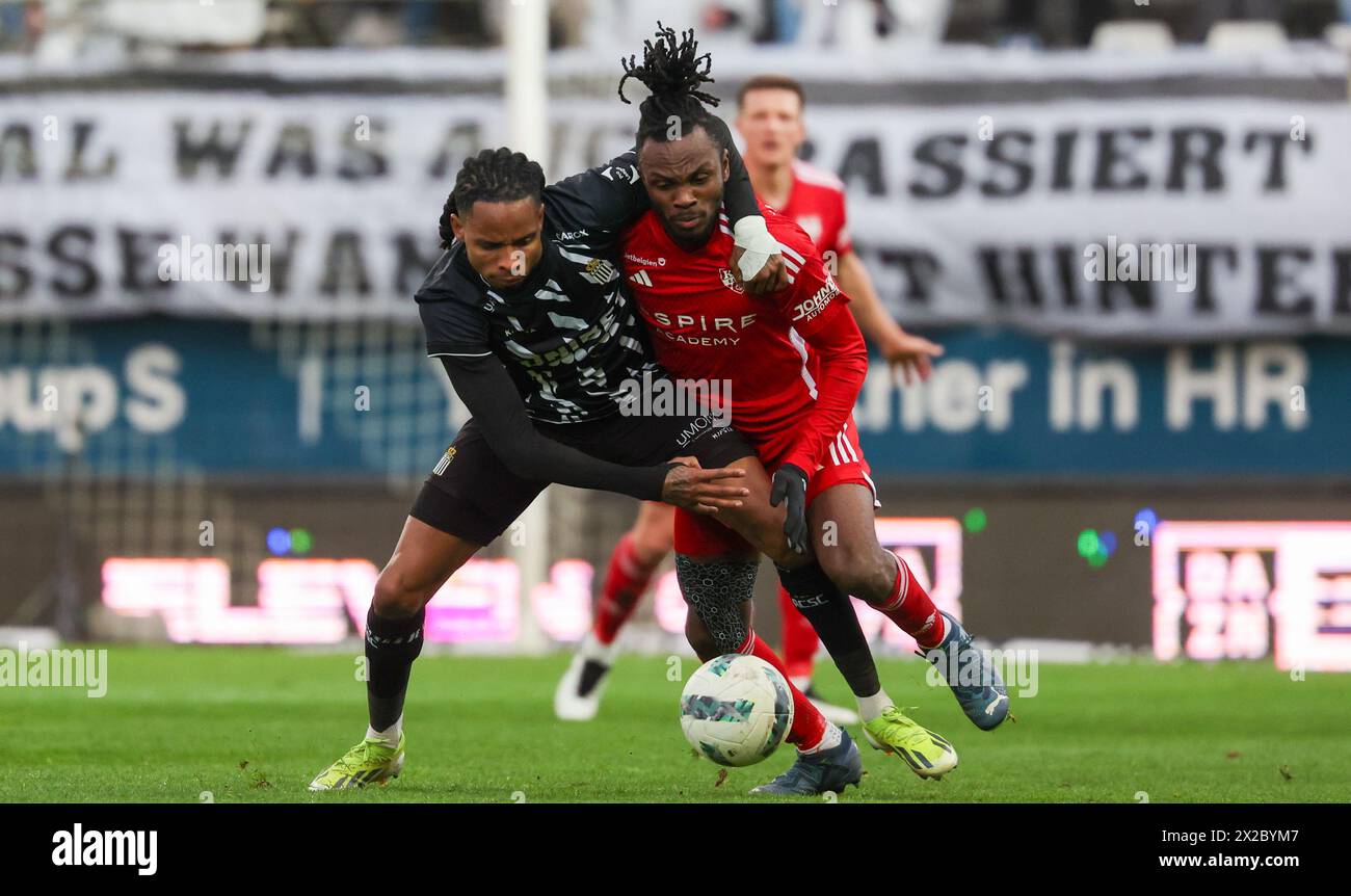 Charleroi, Belgium. 21st Apr, 2024. Charleroi's Jeremy Petris and Eupen's Reagan Charles-Cook fight for the ball during a soccer match between Sporting Charleroi and KAS Eupen, Sunday 21 April 2024 in Charleroi, on day 3/6 of the 2023-2024 'Jupiler Pro League - Relegation Play-offs. BELGA PHOTO VIRGINIE LEFOUR Credit: Belga News Agency/Alamy Live News Stock Photo