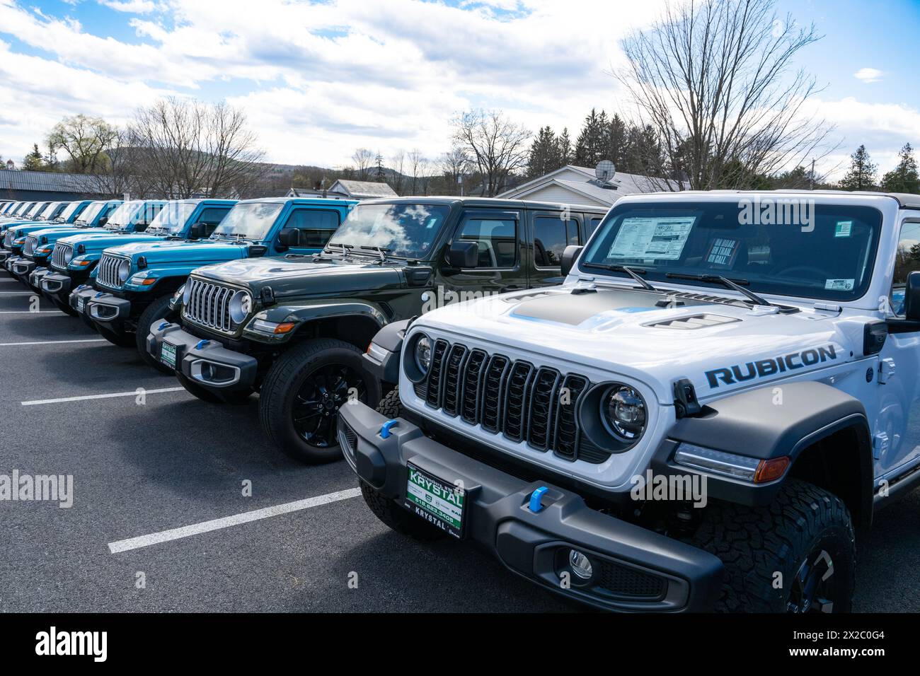 A long line of new Jeep Wranglers for sale on a dealer lot in Warrensburg, NY USA Stock Photo