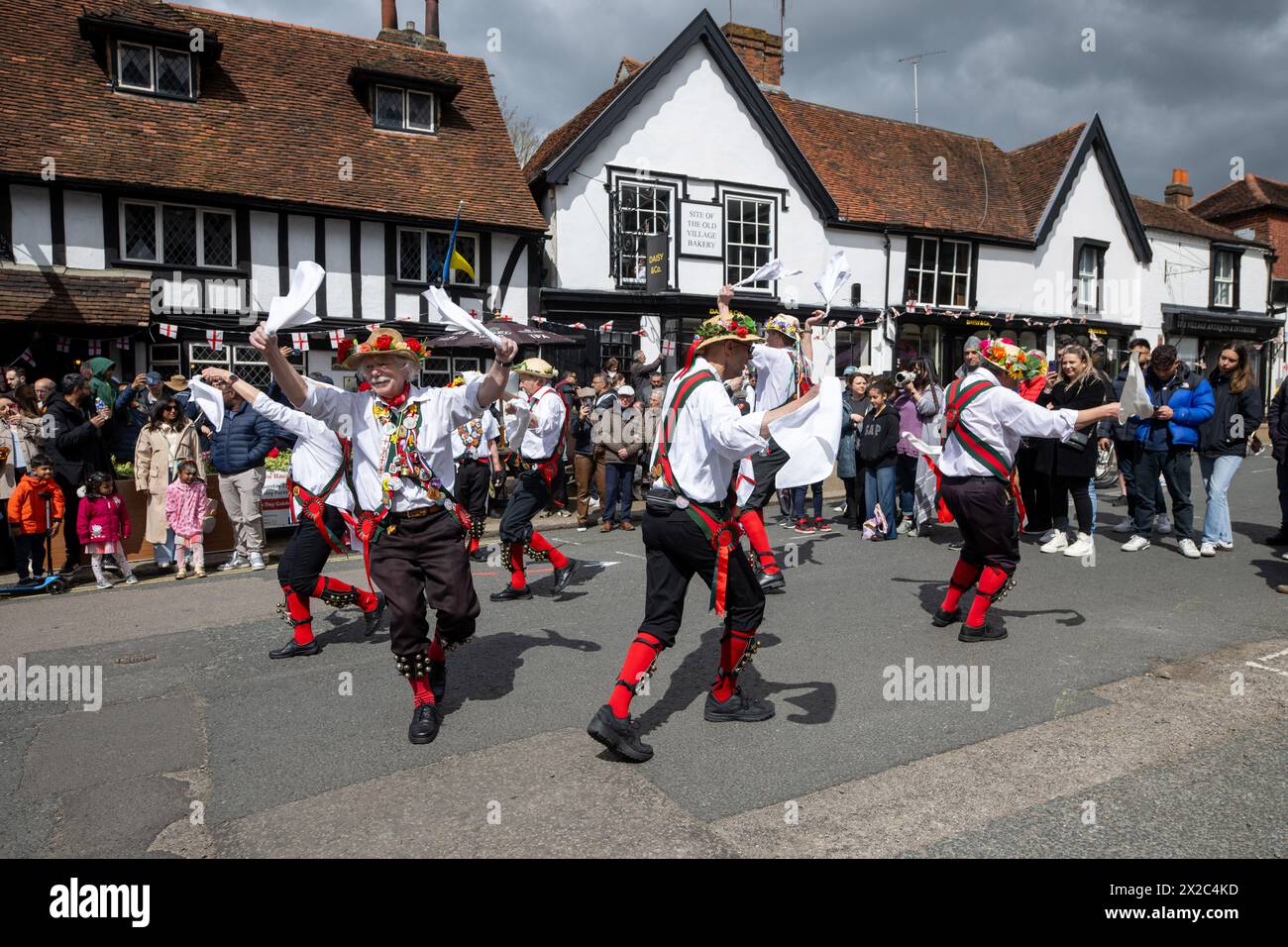 21/04/2024. London, UK Morris Dancing by the Merrydowners perform outside the Queen's Head on Pinner High Street during St Georges Day celebrations in Stock Photo