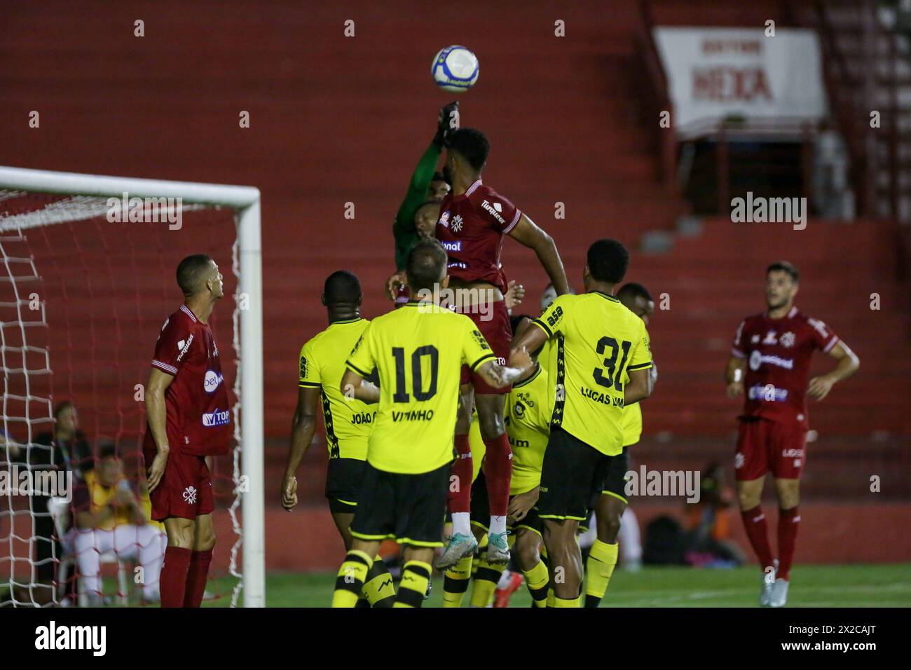 Recife, Brazil. 21st Apr, 2024. PE - RECIFE - 04/21/2024 - BRAZILEIRO C 2024, NAUTICO x SAO BERNARDO - Nautico player Guilherme Matos disputes a shot with Sao Bernardo goalkeeper Alex Alves during a match at the Aflitos stadium for the Brazilian C 2024 championship. Photo: Rafael Vieira/AGIF Credit: AGIF/Alamy Live News Stock Photo