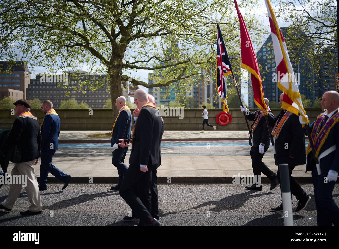 20 Apr 2024 LondonUK - March by Loyal Orange Institution of England and other Orange Lodges along Millbank in London Stock Photo