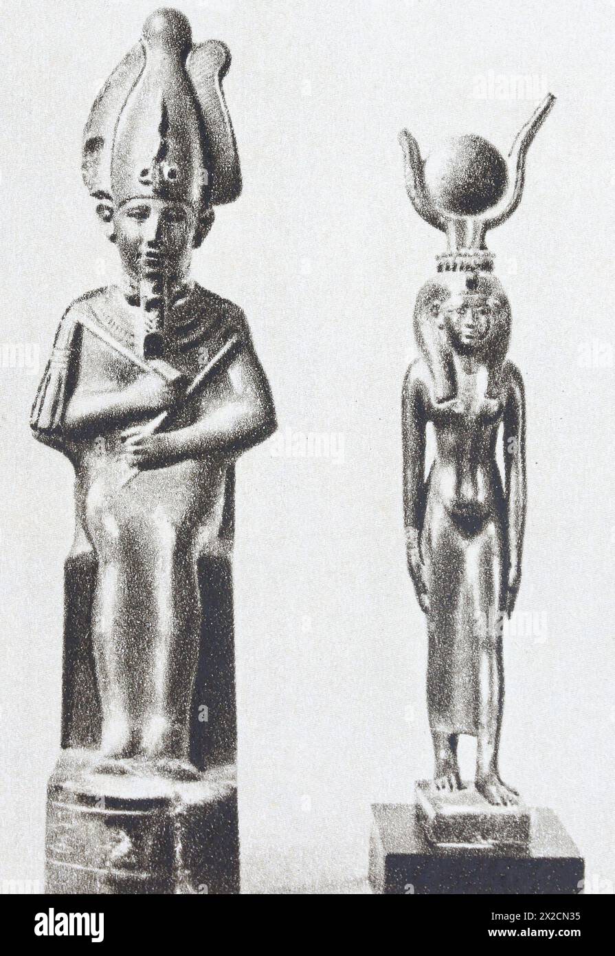 Ancient Egyptian figurines of Osiris and Isis from the 1st millennium BC. Photo from the mid-20th century. Stock Photo