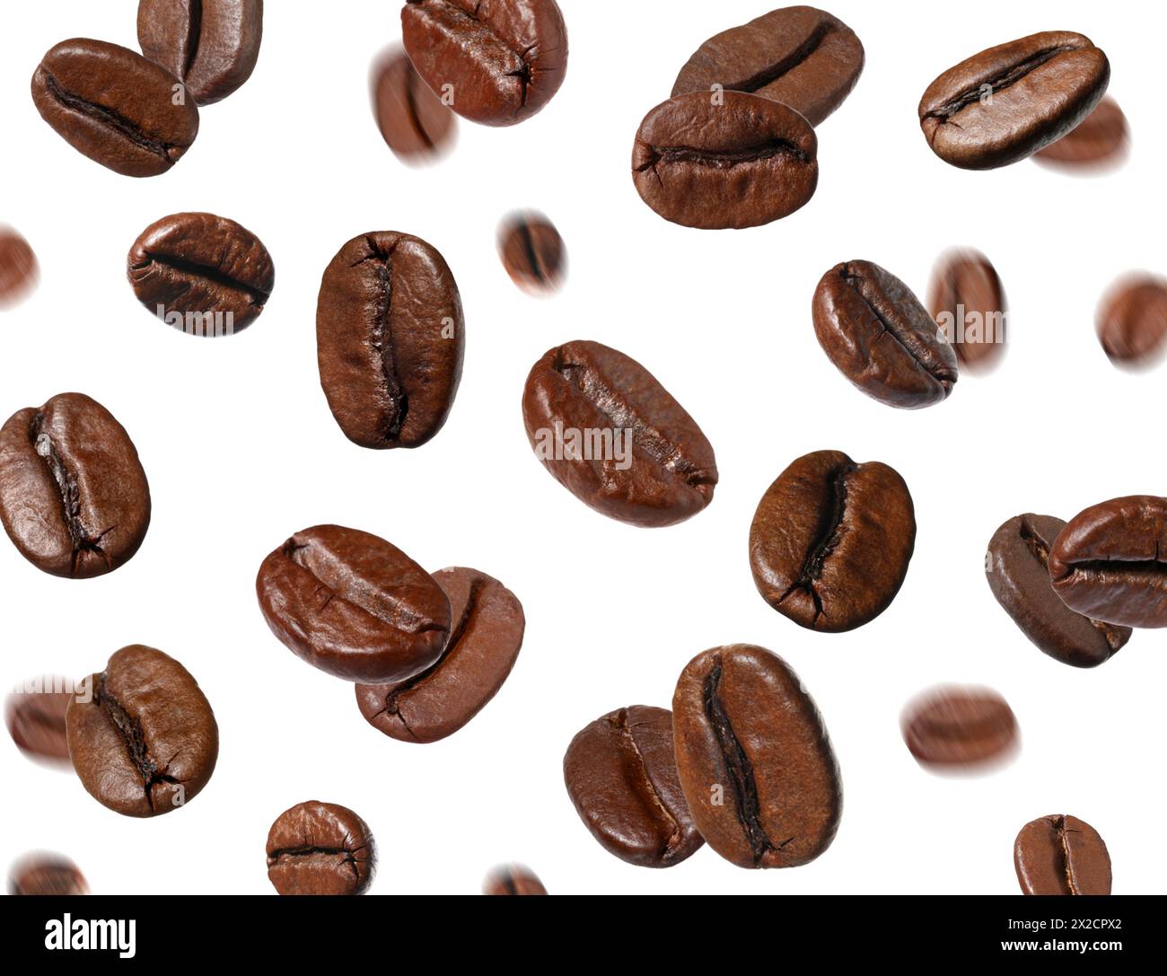 Roasted coffee beans falling on white background Stock Photo - Alamy