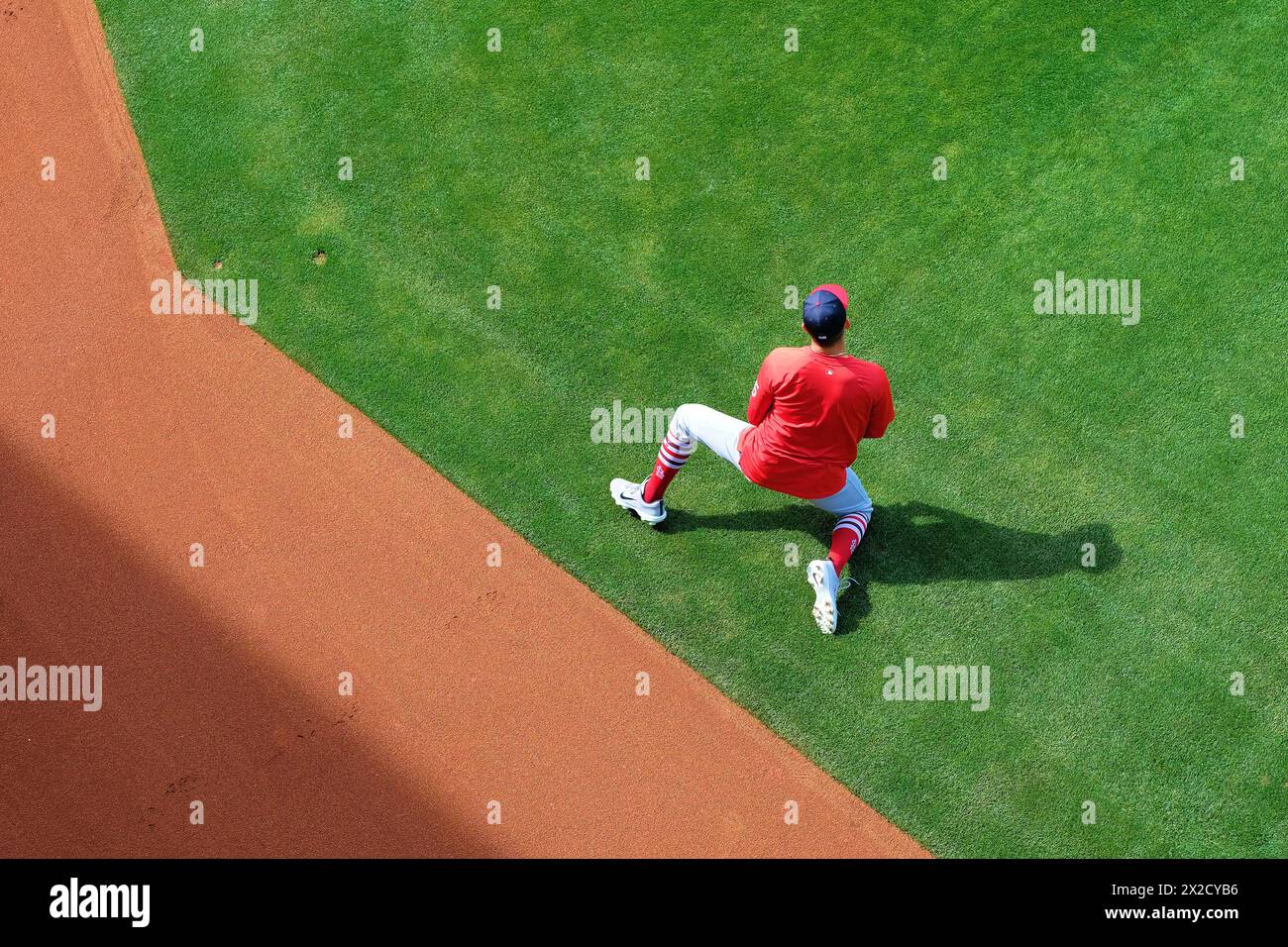 Professional baseball player stretches and warms up; St. Louis Cardinals pregame routine to get ready for a ballgame; Oakland Coliseum, California. Stock Photo