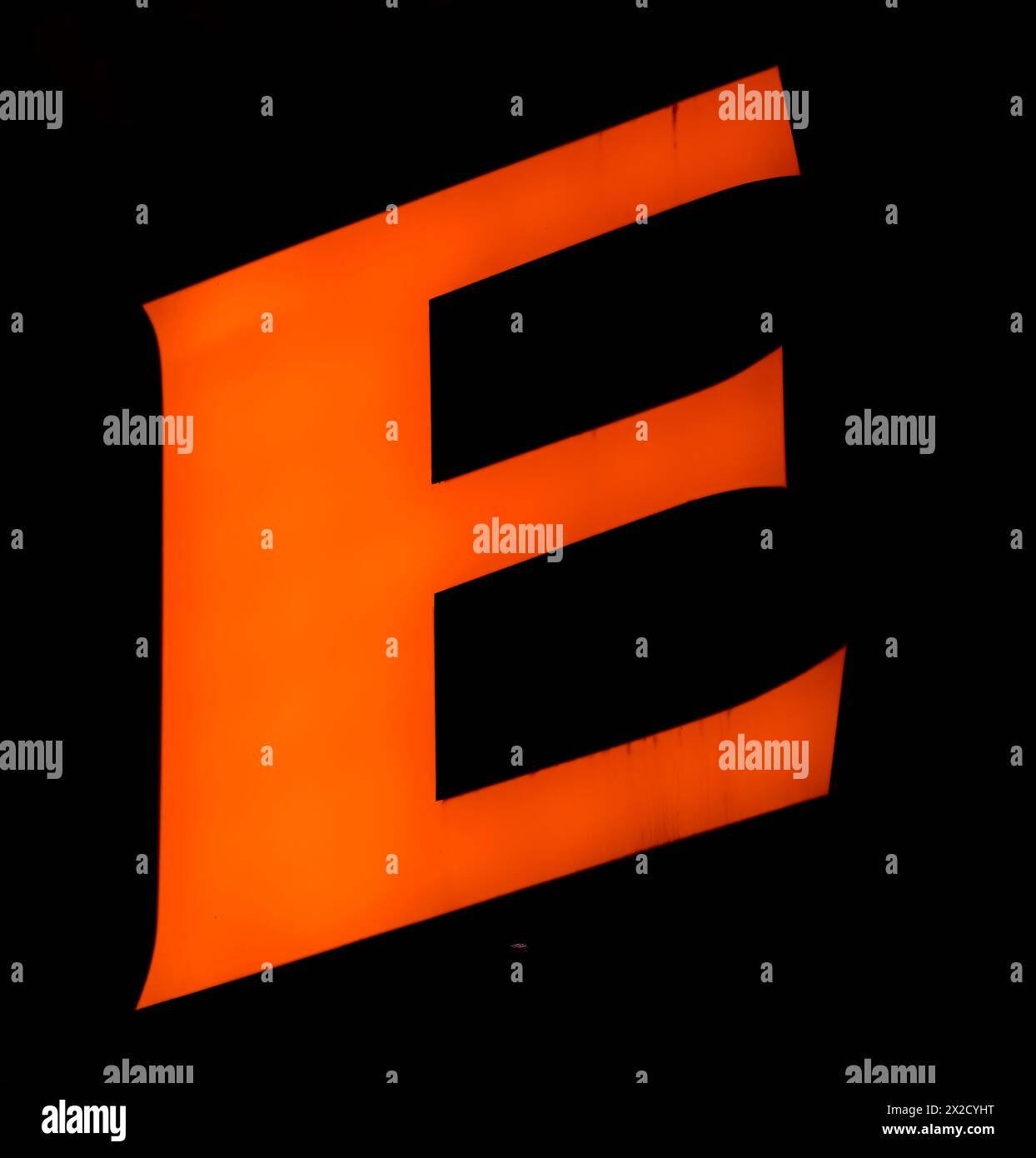 Electric orange 'E' stands out against the black, its three stripes