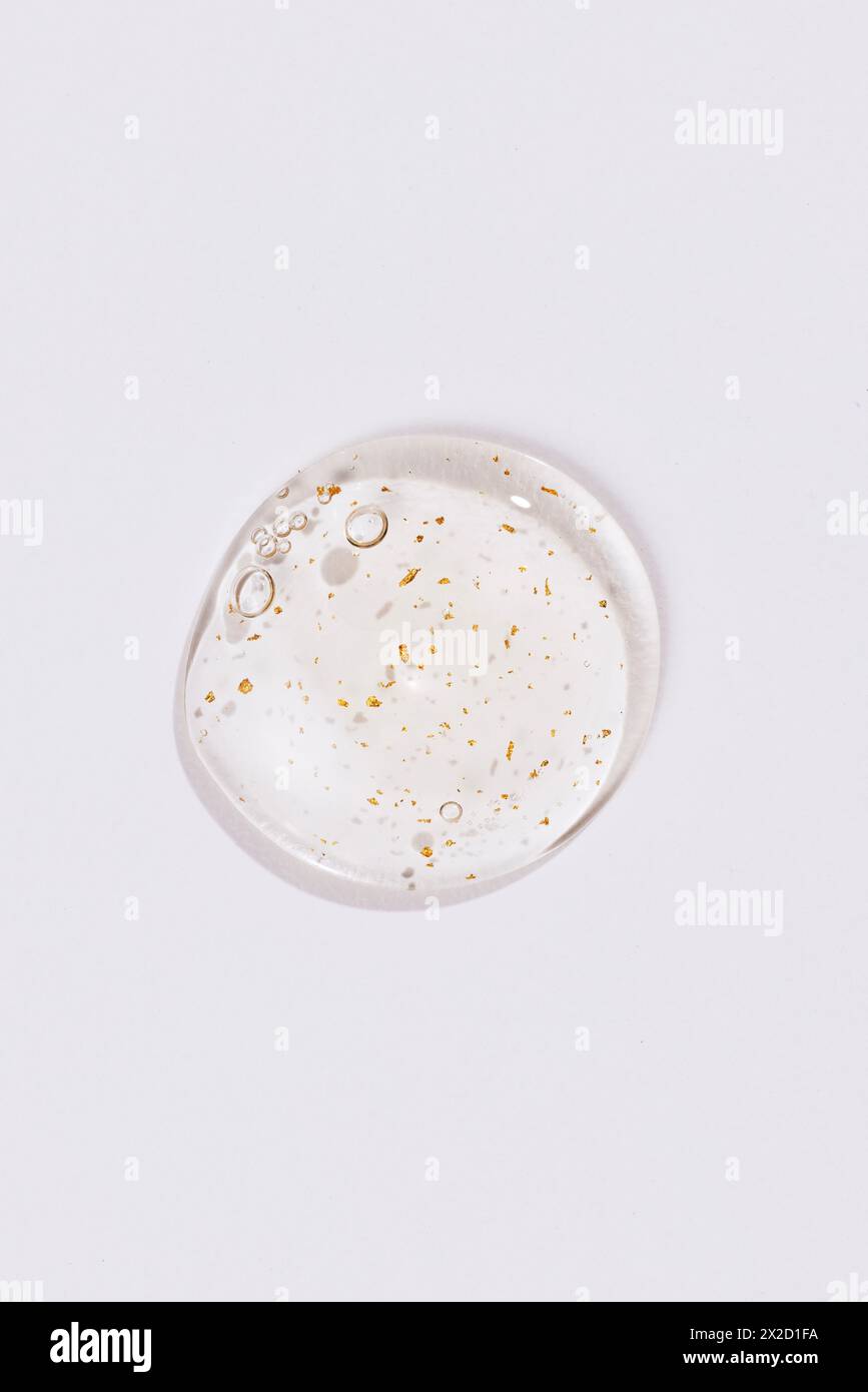 An ampoule with gold grains on a white background stock photo alamy