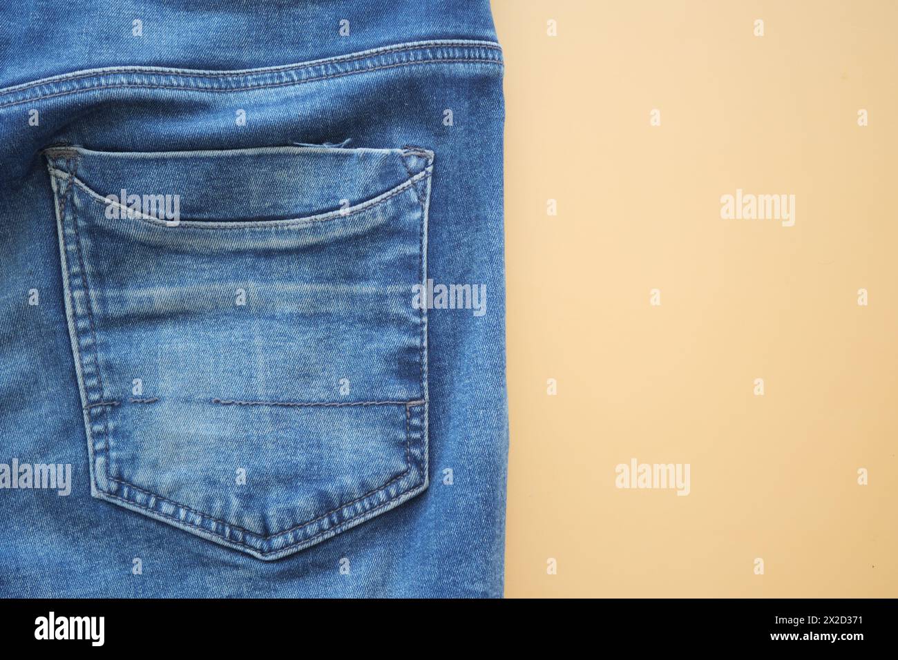 man jeans on a bright yellow background with copy space. Stock Photo