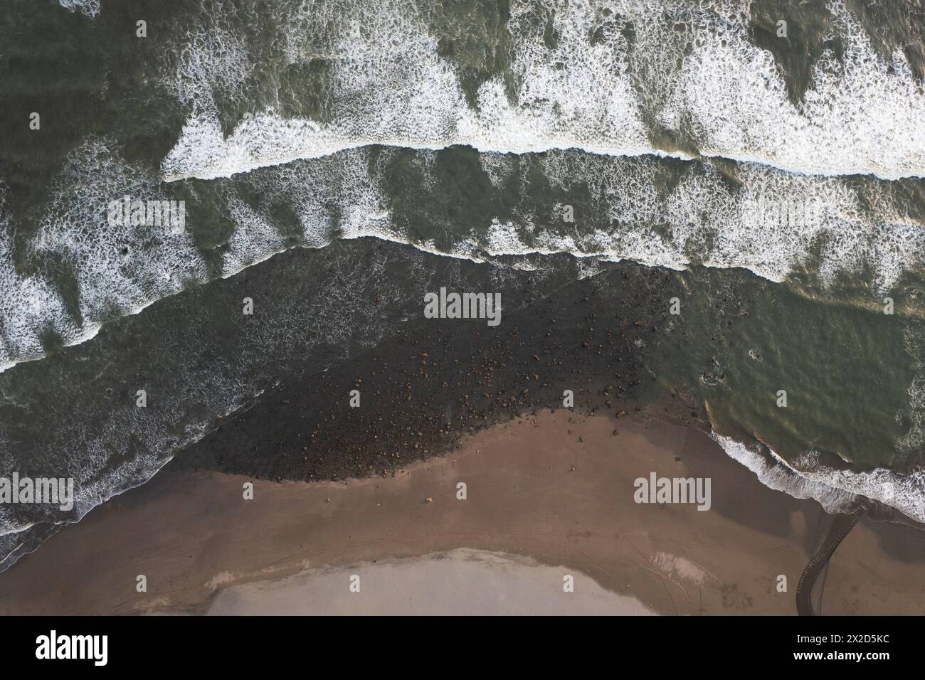 Wild beach background with small stones aerial drone view Stock Photo