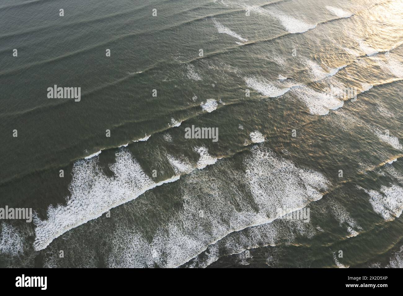Ocean waves background on susnet light aerial drone view Stock Photo
