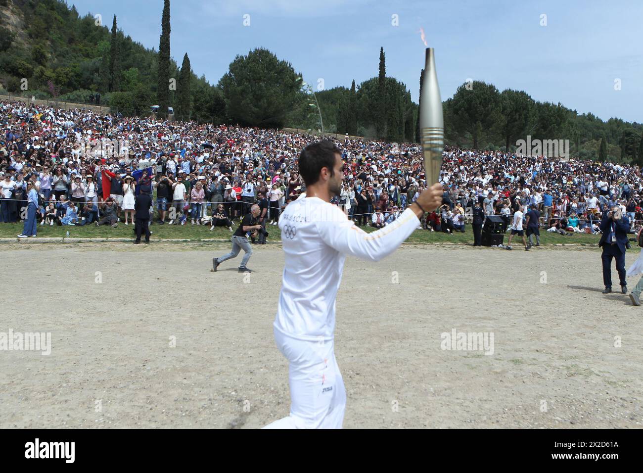 The first torch bearer, Greek olympic gold medalist Stefanos Douskos ...