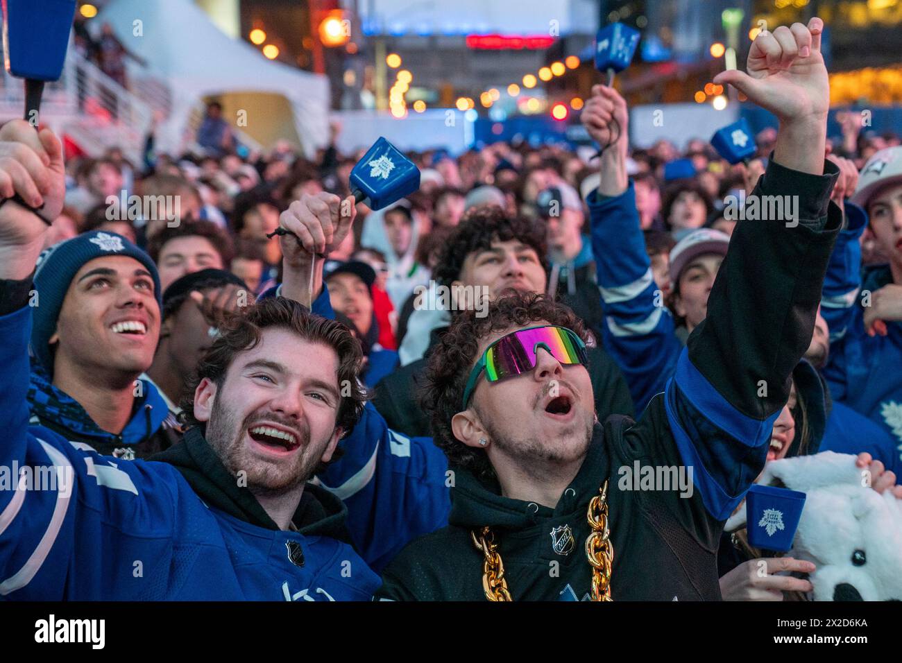 fans-watching-the-game-on-a-giant-screen-react-as-the-toronto-maple