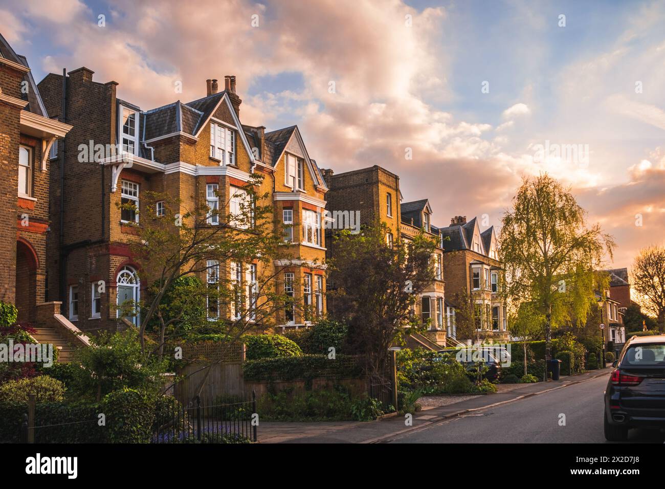 View of traditional residential street in  English town at sunset Stock Photo