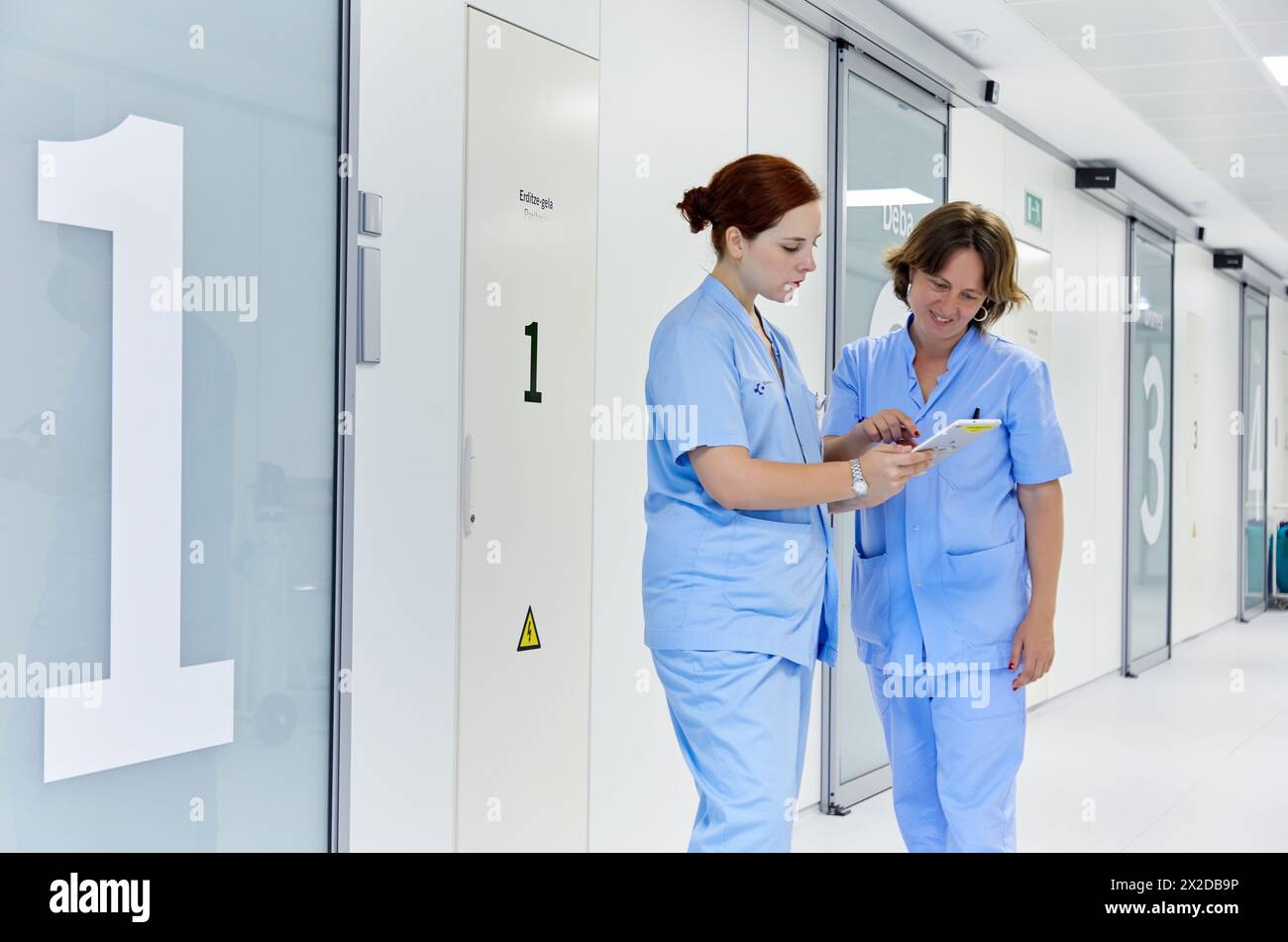 Nurses with tablet, Hall, Delivery room, Maternity ward, Hospital Donostia, San Sebastian, Gipuzkoa, Basque Country, Spain Stock Photo