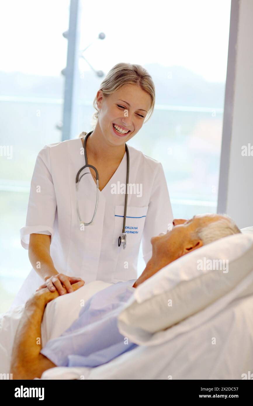 doctor attending to patient in hospital room, Onkologikoa Hospital, Oncology Institute, Case Center for prevention, diagnosis and treatment of cancer, Stock Photo