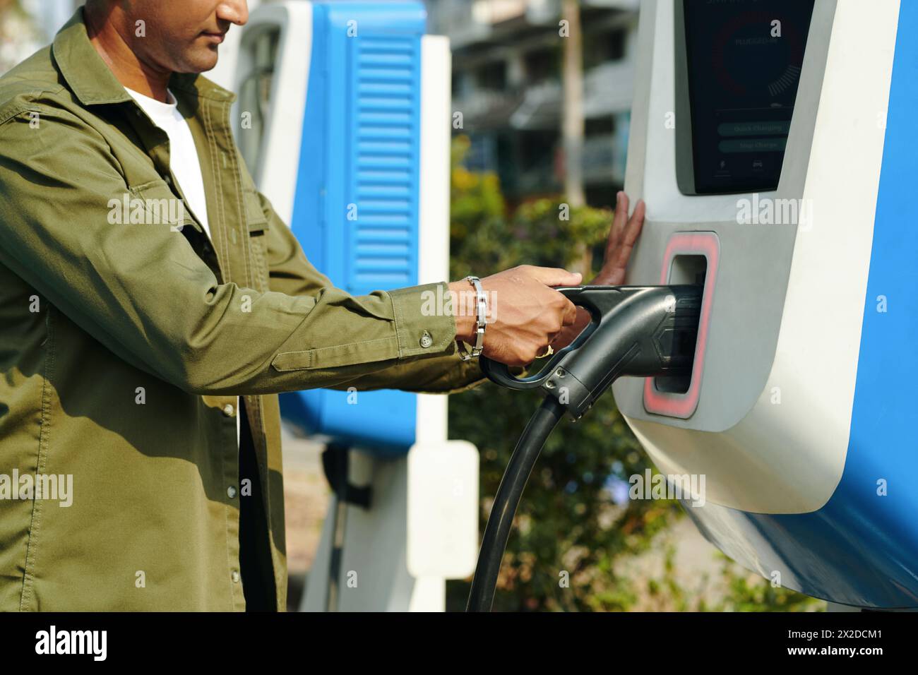 Cropped image of driver using public charging point Stock Photo