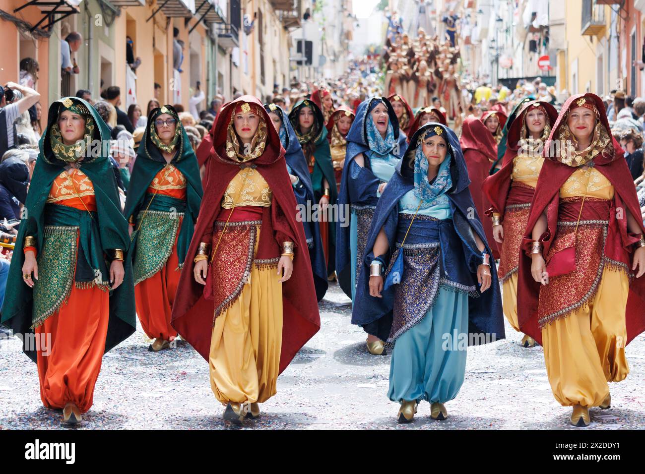 Alcoy, Spain, 04-20-2024: Women of the Muslim entourage accompanying the Moorish Mudejar captain in the Moors and Christians parade of Alcoy, a festiv Stock Photo