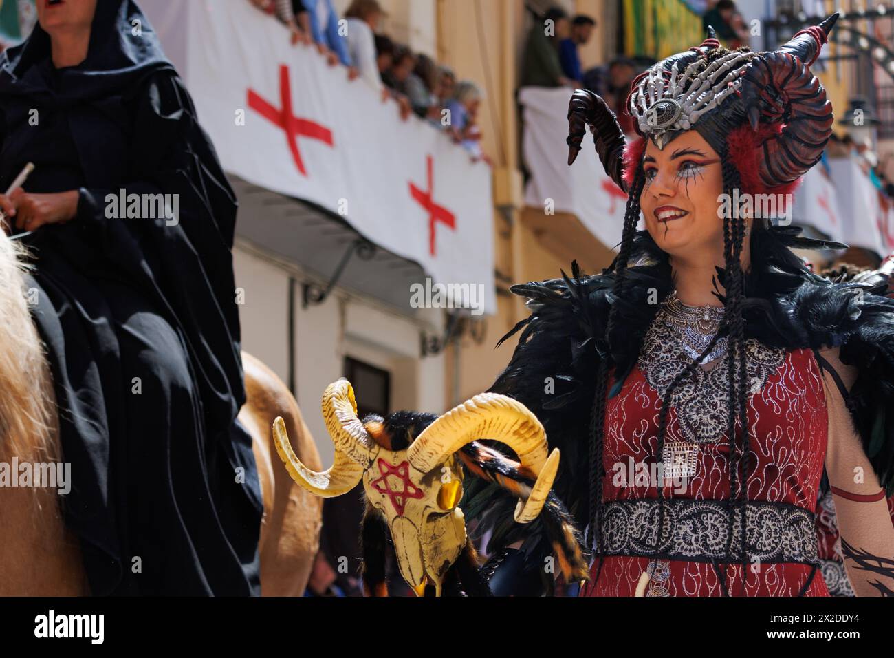 04-20-2024, Alcoy, Spain: Warrior woman parading through the streets of Alcoy in the Moors and Christians parade. Popular festivals declared of intern Stock Photo