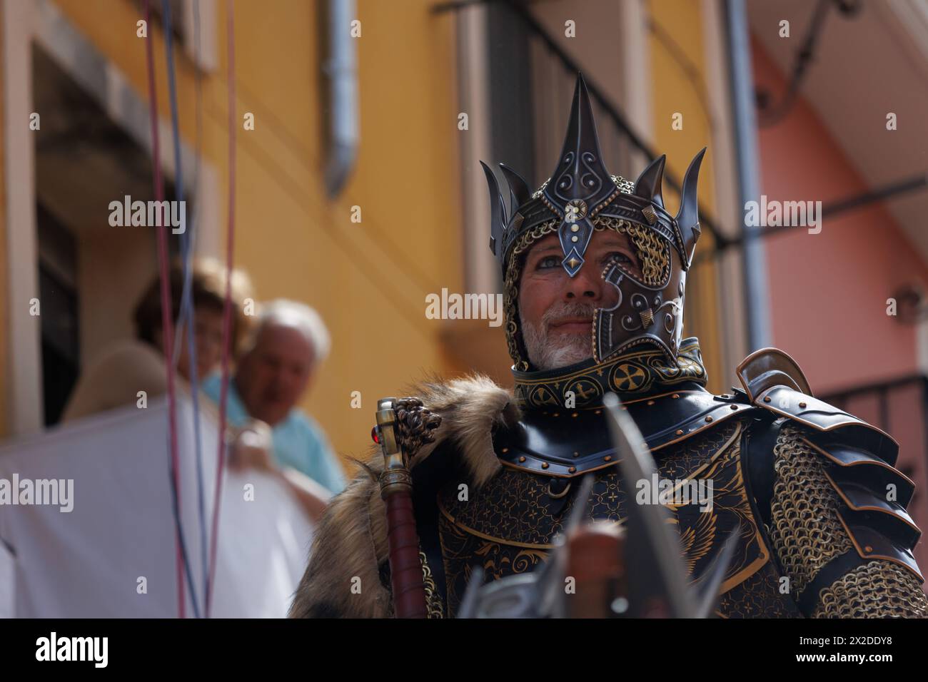 04-20-2024, Alcoy, Spain: Christian alferez of the Aragoneses troupe with a lost look due to the emotion in the parade. Popular festivals declared of Stock Photo