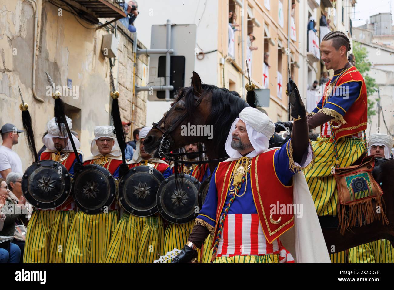 04-20-2024, Alcoy, Spain: Barrier of shields and spears of the Mudejar group parading through the streets of Alcoy. Popular festivals declared of inte Stock Photo