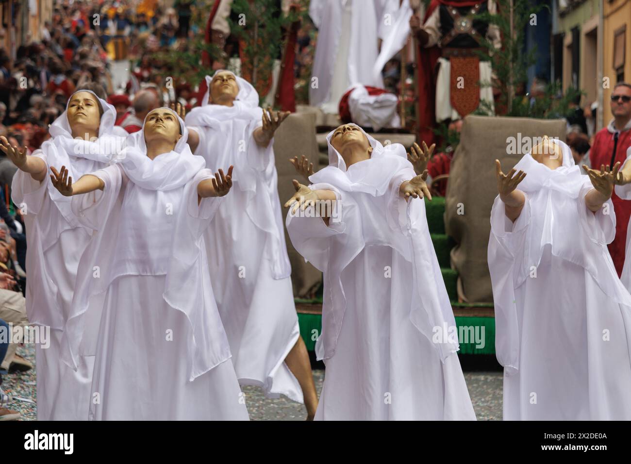 Alcoy, Spain, 04-20-2024: Street ballet in the parade of Moors and Christians accompanying the captain of the Alcodianos troupe Stock Photo