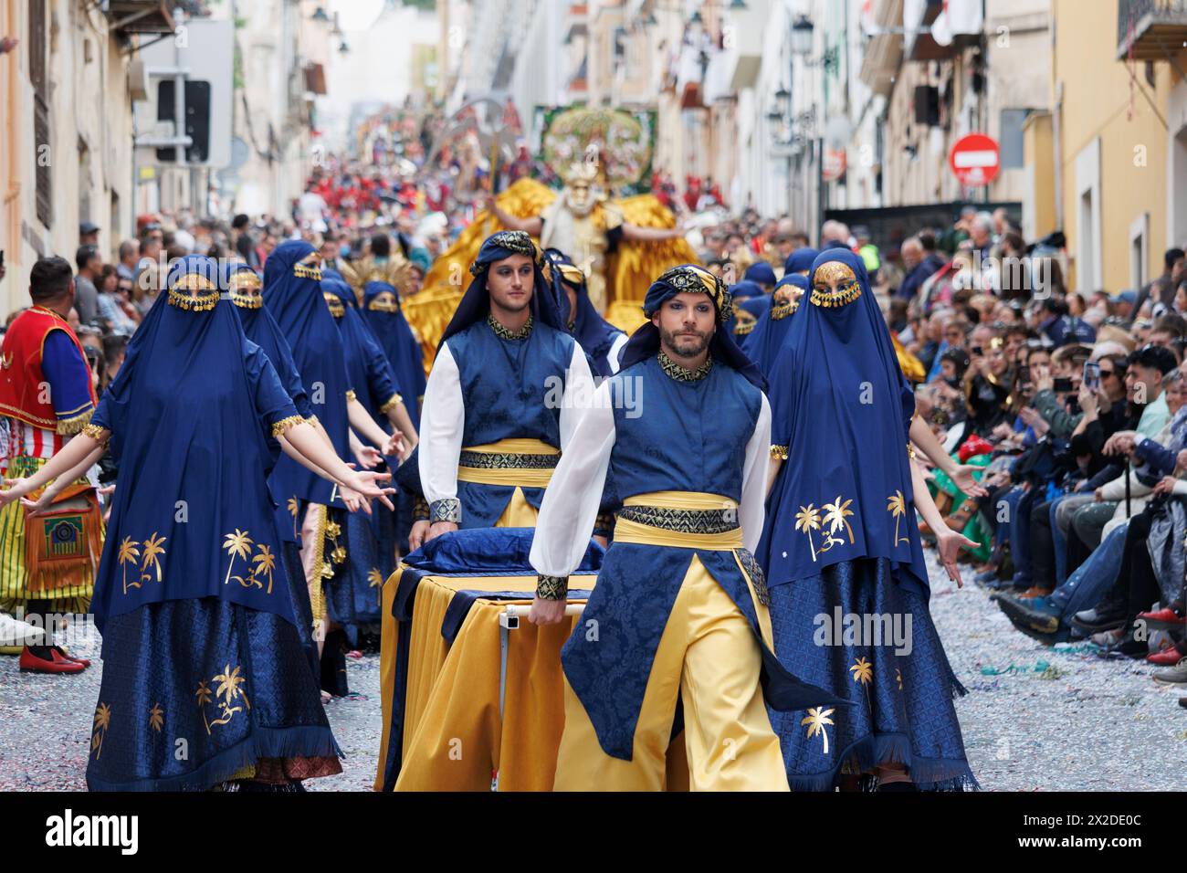 Alcoy, Spain, 04-20-2024: Street ballet in the parade of Moors and Christians accompanying the captain of the Alcodianos troupe Stock Photo