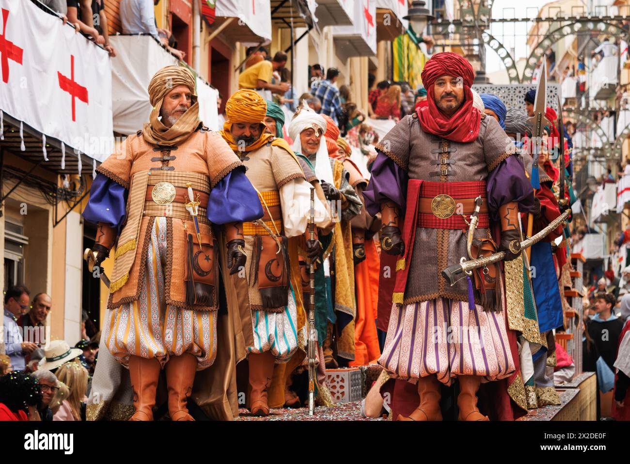 04-20-2024, Alcoy, Spain: Knights armed with sabers in a float from the Mudejar group in a popular parade. Popular festivals declared of international Stock Photo
