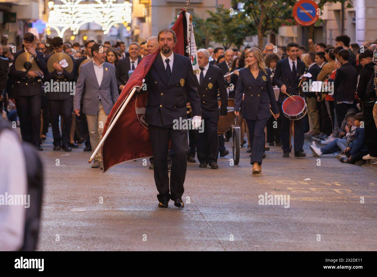 Alcoy, Spain, 04-19-2024: Parade of the Nueva de Alcoy musical corporation accompanying the director of the party anthem Blanca Carbonell Stock Photo