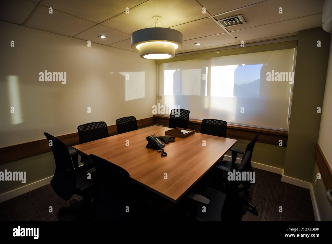 A Square Conference Table in an Office Meeting Room Stock Photo