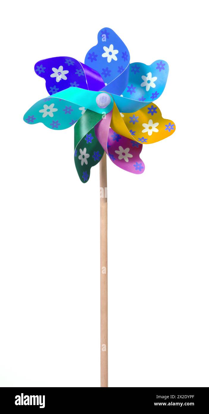 Pinwheeling Colorful pinwheel, spinning toy with wooden stick, isolated Stock Photo ...