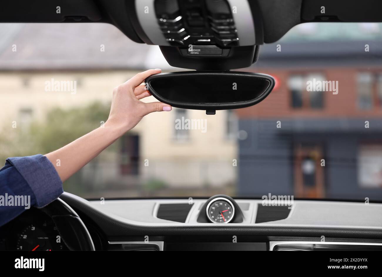 Person looking into the rearview mirror of the car hi-res stock ...