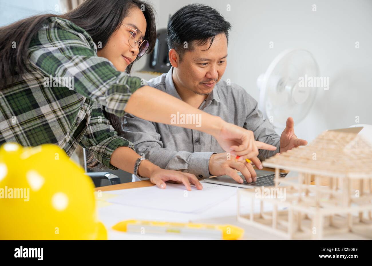 Two architects are working together in the office Stock Photo